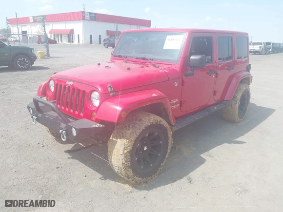 2012 Jeep Wrangler Unlimited Sahara with VIN 1C4HJWEGXCL209449, listed as a IAAI auction lot 41864432 with 100,917 mi miles. Bid and sale history available at carsss.com. Image 2.