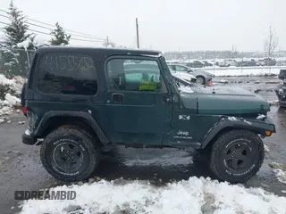 2003 Jeep Wrangler X with VIN 1J4FA39S13P310046, listed as a IAAI auction lot 41555652 with 177,503 mi miles and . Bid and sale history available at DreamBid. Image 14.