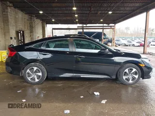 2020 Honda Civic LX z VIN 2HGFC2F61LH587612, wystawiony jako IAAI lot #41955072 z przebiegiem 89 476 mil mil oraz . Historia ofert i sprzedaży dostępna na DreamBid. Obrazek 13.