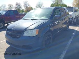 2014 Dodge Grand Caravan SE with VIN 2C4RDGBGXER254634, listed as a IAAI auction lot 42149494 with 158,614 mi miles and . Bid and sale history available at DreamBid. Image 2.