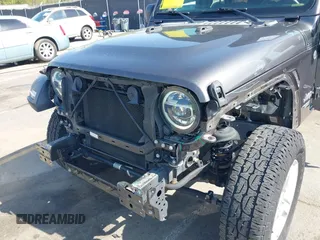 2020 Jeep Wrangler Unlimited Sport Altitude with VIN 1C4HJXDG7LW215344, listed as a IAAI auction lot 41924460 with 51,802 mi miles and . Bid and sale history available at DreamBid. Image 6.