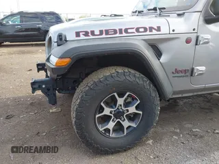 2021 Jeep Wrangler Unlimited Rubicon with VIN 1C4HJXFNXMW560512, listed as a IAAI auction lot 42124812 with 18,034 mi miles and . Bid and sale history available at DreamBid. Image 6.