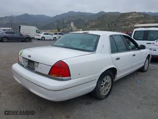 2003 Ford Crown Victoria LX with VIN 2FAFP74WX3X154904, listed as a IAAI auction lot 42094274 with 123,579 mi miles. Bid and sale history available at carsss.com. Image 4.