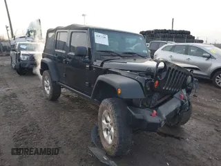2013 Jeep Wrangler Unlimited Freedom z VIN 1C4BJWDG7DL690964, wystawiony jako IAAI lot #41471286 z przebiegiem 168 565 mil mil oraz . Historia ofert i sprzedaży dostępna na DreamBid. Obrazek 1.