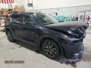 2018 Mazda CX-5 Grand Touring with VIN JM3KFADM3J0325843, listed as a Copart auction lot 87958375 with 93,577 mi miles and Salvage title. Bid and sale history available at DreamBid. Image 4.