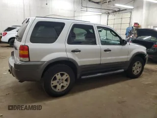2006 Ford Escape XLT with VIN 1FMCU03106KC14923, listed as a Copart auction lot 52727095 with 126,842 mi miles and Salvage Title. Bid and sale history available at DreamBid. Image 3.