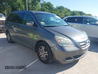 2007 Honda Odyssey EX-L z VIN 5FNRL38787B080046, wystawiony jako IAAI lot #42240227 z przebiegiem 138 073 mil mil oraz . Historia ofert i sprzedaży dostępna na DreamBid. Obrazek 1.