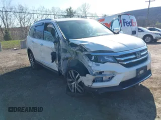 2016 Honda Pilot Touring with VIN 5FNYF6H98GB017079, listed as a IAAI auction lot 42055272 with 142,726 mi miles and . Bid and sale history available at DreamBid. Image 6.