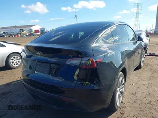 2024 Tesla Model Y with VIN 7SAYGDED5RF093018, listed as a IAAI auction lot 41747467 with 60,469 mi miles and . Bid and sale history available at DreamBid. Image 4.