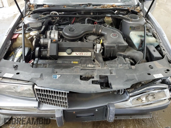 1991 Cadillac Seville z VIN 1G6KS53B2MU809384, wystawiony jako Copart lot #77185134 z przebiegiem 134 769 mil mil oraz Szkody całkowita. Historia ofert i sprzedaży dostępna na DreamBid. Obrazek 11.