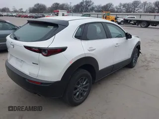 2022 Mazda CX-30 S with VIN 3MVDMBALXNM422418, listed as a IAAI auction lot 41531552 with 21,909 mi miles and . Bid and sale history available at carsss.com. Image 4.