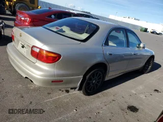 1997 Mazda Millenia S z VIN JM1TA2229V1307575, wystawiony jako Copart lot #87040954 z przebiegiem 160 513 mil mil oraz Szkody całkowita. Historia ofert i sprzedaży dostępna na DreamBid. Obrazek 3.