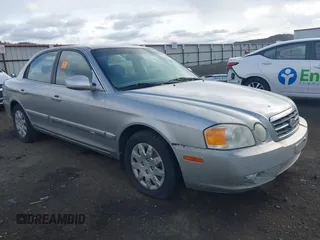 2004 Kia Optima LX z VIN KNAGD126345255841, wystawiony jako IAAI lot #42063336 z przebiegiem 176 320 mil mil oraz . Historia ofert i sprzedaży dostępna na DreamBid. Obrazek 1.