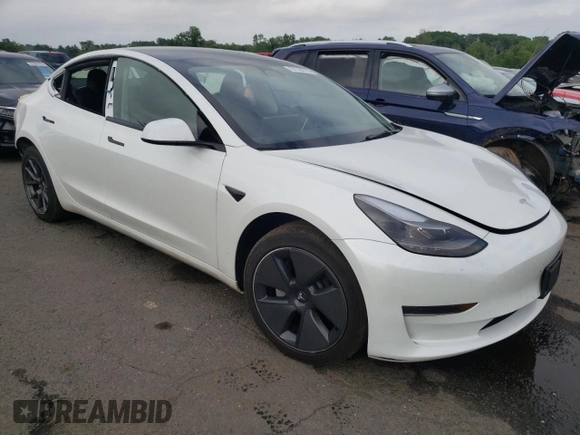2023 Tesla Model 3 with VIN 5YJ3E1EA6PF563331, listed as a Copart auction lot 61124715 with 26,198 mi miles and Salvage title. Bid and sale history available at DreamBid. Image 4.