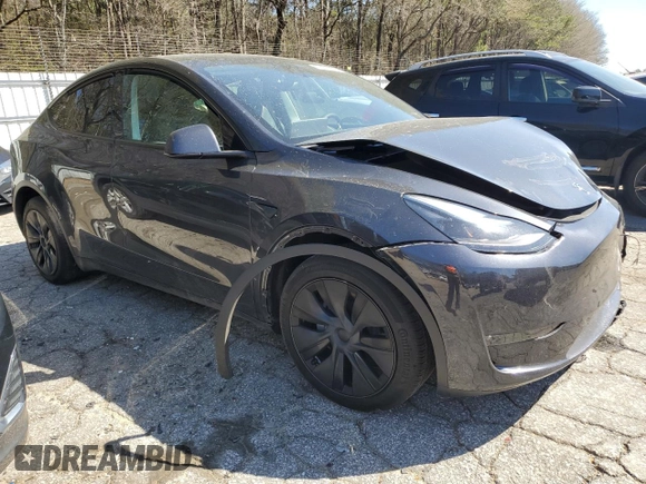 2024 Tesla Model Y Long Range z VIN 7SAYGDEE3RA323029, wystawiony jako Copart lot #50171805 z przebiegiem Nie podano mil oraz Szkoda całkowita • Salvage title. Historia ofert i sprzedaży dostępna na DreamBid. Obrazek 4.