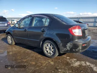 2012 Suzuki SX4 LE with VIN JS2YC5A3XC6303083, listed as a Copart auction lot 89265635 with 155,316 mi miles and Salvage Title. Bid and sale history available at carsss.com. Image 2.