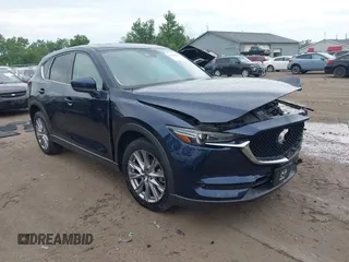 2019 Mazda CX-5 Grand Touring with VIN JM3KFBDMXK1683913, listed as a IAAI auction lot 42627629 with 89,566 mi miles and . Bid and sale history available at DreamBid. Image 1.