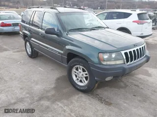 2003 Jeep Grand Cherokee Laredo with VIN 1J4GW48S93C583644, listed as a IAAI auction lot 41656314 with 256,653 mi miles. Bid and sale history available at carsss.com. Image 1.