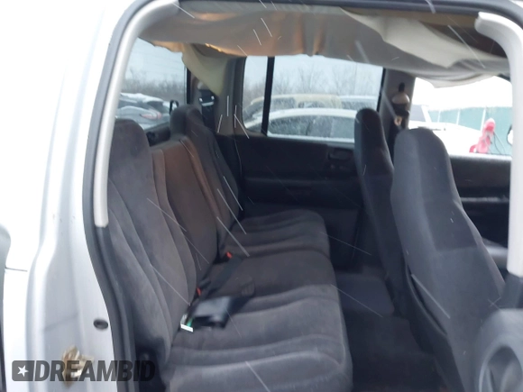 2004 Dodge Dakota SLT with VIN 1D7HG48N34S665027, listed as a IAAI auction lot 41395509 with 128,064 mi miles. Bid and sale history available at carsss.com. Image 8.