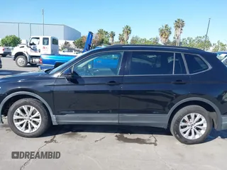 2018 Volkswagen Tiguan S with VIN 3VV1B7AX1JM091928, listed as a IAAI auction lot 42283454 with 53,650 mi miles and . Bid and sale history available at DreamBid. Image 14.