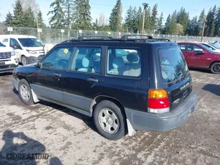 1999 Subaru Forester L with VIN JF1SF6351XH716957, listed as a IAAI auction lot 41969521 with 253,696 mi miles. Bid and sale history available at carsss.com. Image 3.