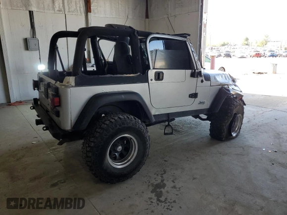 2006 Jeep Wrangler Rubicon with VIN 1J4FA69S26P734731, listed as a Copart auction lot 52009295 with 117,872 mi miles and Salvage title. Bid and sale history available at DreamBid. Image 3.