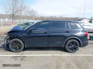2023 Volkswagen Tiguan SE R-Line Black with VIN 3VVCB7AXXPM094621, listed as a IAAI auction lot 41737103 with 21,069 mi miles. Bid and sale history available at carsss.com. Image 14.