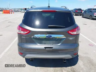 2015 Ford Escape Titanium z VIN 1FMCU9J92FUB01007, wystawiony jako IAAI lot #42319246 z przebiegiem 90 782 mil mil oraz . Historia ofert i sprzedaży dostępna na DreamBid. Obrazek 17.