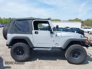 2003 Jeep Wrangler Sport z VIN 1J4FA49S73P302278, wystawiony jako IAAI lot #42219582 z przebiegiem 129 089 mil mil oraz . Historia ofert i sprzedaży dostępna na DreamBid. Obrazek 13.