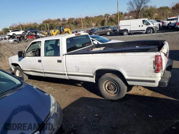 1999 GMC Sierra 1500 with VIN 1GTGC33RXXF096504, listed as a Copart auction lot 80027354 with 124,430 mi miles and Clean Title. Bid and sale history available at DreamBid. Image 2.