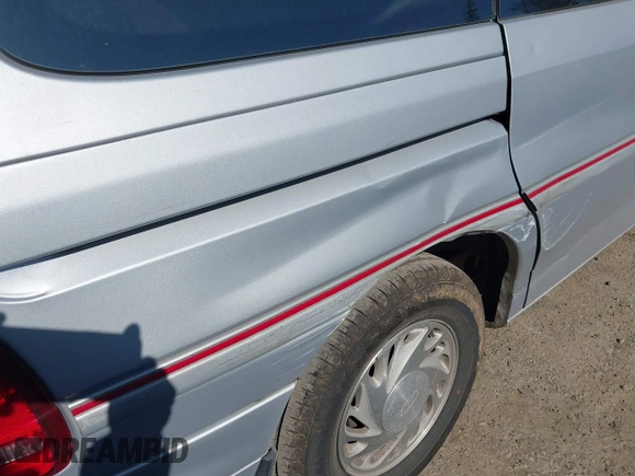 1996 Ford Windstar GL z VIN 2FMDA5148TBB09866, wystawiony jako IAAI lot #41738735 z przebiegiem 160 363 mil mil oraz . Historia ofert i sprzedaży dostępna na DreamBid. Obrazek 6.