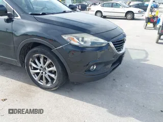 2015 Mazda CX-9 Grand Touring z VIN JM3TB2DA1F0456773, wystawiony jako IAAI lot #42257555 z przebiegiem 152 890 mil mil oraz . Historia ofert i sprzedaży dostępna na DreamBid. Obrazek 6.