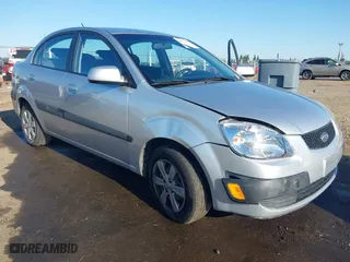 2009 Kia Rio SX with VIN KNADE223296523842, listed as a IAAI auction lot 42024905 with 98,613 mi miles. Bid and sale history available at carsss.com. Image 6.