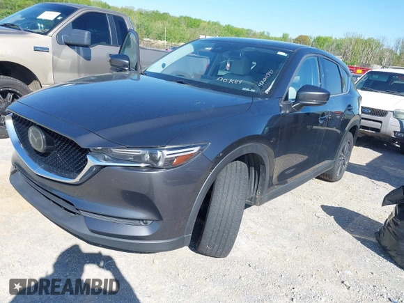 2018 Mazda CX-5 Grand Touring with VIN JM3KFBDM7J0454836, listed as a IAAI auction lot 42001397 with 146,879 mi miles. Bid and sale history available at carsss.com. Image 2.