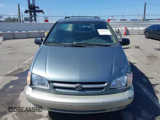 1999 Toyota Sienna LE with VIN 4T3ZF13C5XU099020, listed as a IAAI auction lot 41709287 with 206,884 mi miles. Bid and sale history available at carsss.com. Image 12.