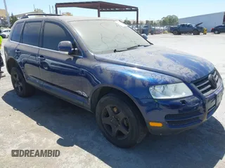 2004 Volkswagen Touareg with VIN WVGBC67L54D032570, listed as a IAAI auction lot 42561094 with 146,805 mi miles and . Bid and sale history available at DreamBid. Image 1.