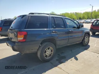 2004 Jeep Grand Cherokee Laredo with VIN 1J4GX48S74C195326, listed as a Copart auction lot 53993785 with 280,456 mi miles and Salvage title. Bid and sale history available at DreamBid. Image 3.