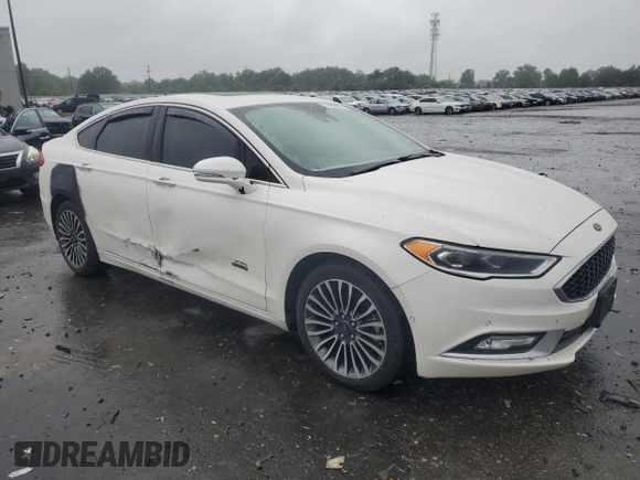 2017 Ford Fusion Titanium z VIN 3FA6P0SUXHR268559, wystawiony jako Copart lot #57456085 z przebiegiem 124 072 mil mil oraz Szkoda całkowita • Salvage title. Historia ofert i sprzedaży dostępna na DreamBid. Obrazek 4.