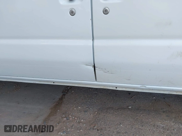 2010 Ford Econoline Cargo Commercial with VIN 1FTNE1EW4ADA91939, listed as a IAAI auction lot 42156334 with 311,000 mi miles and . Bid and sale history available at DreamBid. Image 12.
