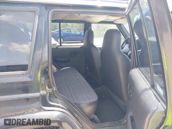 2000 Jeep Cherokee z VIN 1J4FF48S7YL273642, wystawiony jako IAAI lot #42743391 z przebiegiem 200 780 mil mil oraz . Historia ofert i sprzedaży dostępna na DreamBid. Obrazek 8.