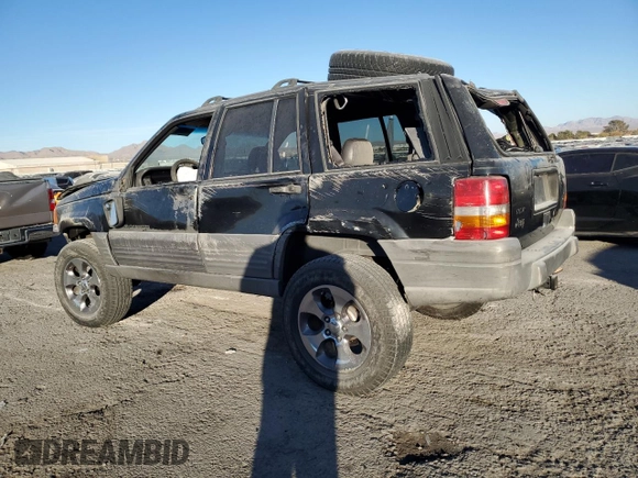 1998 Jeep Grand Cherokee Laredo with VIN 1J4FX58S4WC102623, listed as a Copart auction lot 86188764 with 283,210 mi miles and Salvage Title. Bid and sale history available at carsss.com. Image 2.
