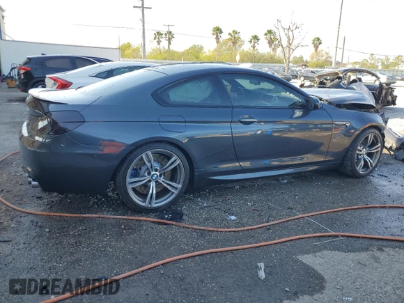 2015 BMW M6 z VIN WBSLX9C59FD160716, wystawiony jako Copart lot #47144925 z przebiegiem 55 535 mil mil oraz Szkody całkowita. Historia ofert i sprzedaży dostępna na DreamBid. Obrazek 3.