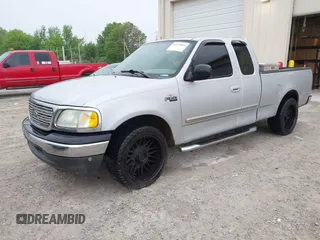 2003 Ford F-150 XL with VIN 1FTRX17253NA74389, listed as a IAAI auction lot 42072045 with 166,572 mi miles. Bid and sale history available at carsss.com. Image 2.