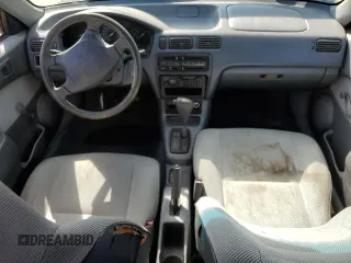 1996 Toyota Tercel DX z VIN JT2AC52L8T0124403, wystawiony jako Copart lot #66195834 z przebiegiem 137 467 mil mil oraz Szkody całkowita. Historia ofert i sprzedaży dostępna na DreamBid. Obrazek 8.