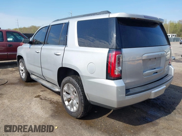2015 GMC Yukon SLE with VIN 1GKS1AKC8FR540627, listed as a IAAI auction lot 42004023 with 128,195 mi miles. Bid and sale history available at carsss.com. Image 3.