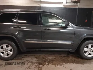 2011 Jeep Grand Cherokee 70th Anniversary with VIN 1J4RR4GG3BC566690, listed as a IAAI auction lot 41810545 with 173,886 mi miles. Bid and sale history available at carsss.com. Image 13.