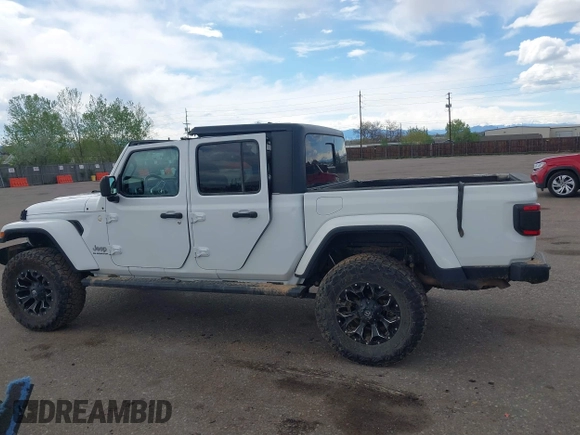 2021 Jeep Gladiator High Altitude with VIN 1C6HJTFG2ML567988, listed as a IAAI auction lot 42103576 with 74,849 mi miles and . Bid and sale history available at DreamBid. Image 14.