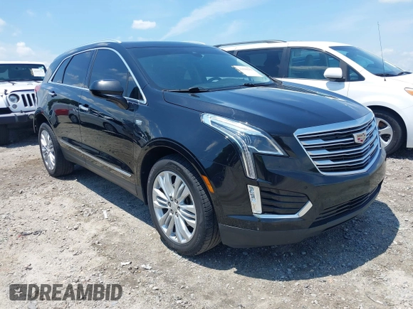 2018 Cadillac XT5 Premium Luxury AWD z VIN 1GYKNFRS3JZ112459, wystawiony jako IAAI lot #42590258 z przebiegiem 157 377 mil mil oraz . Historia ofert i sprzedaży dostępna na DreamBid. Obrazek 1.