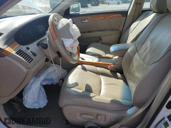 2007 Toyota Avalon XL z VIN 4T1BK36BX7U237820, wystawiony jako Copart lot #53845505 z przebiegiem 120 698 mil mil oraz Szkody całkowita. Historia ofert i sprzedaży dostępna na DreamBid. Obrazek 7.