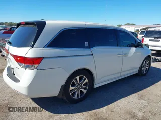 2015 Honda Odyssey Touring Elite with VIN 5FNRL5H96FB090702, listed as a IAAI auction lot 41825889 with 118,157 mi miles and . Bid and sale history available at DreamBid. Image 4.